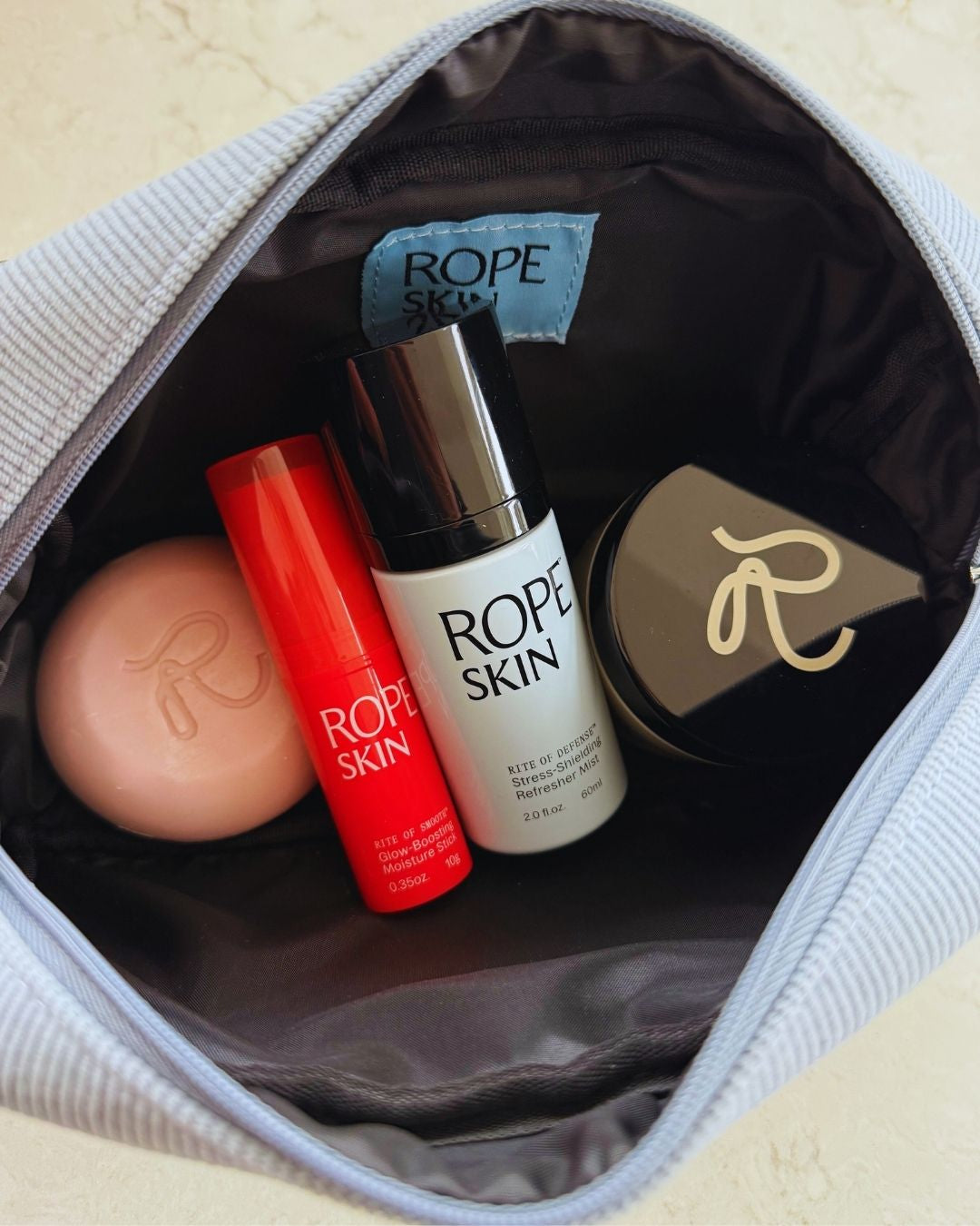 The RITE Bag for skincare products with our 4 products