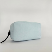 Light blue rectangular pouch with a black zipper on a light gray background
